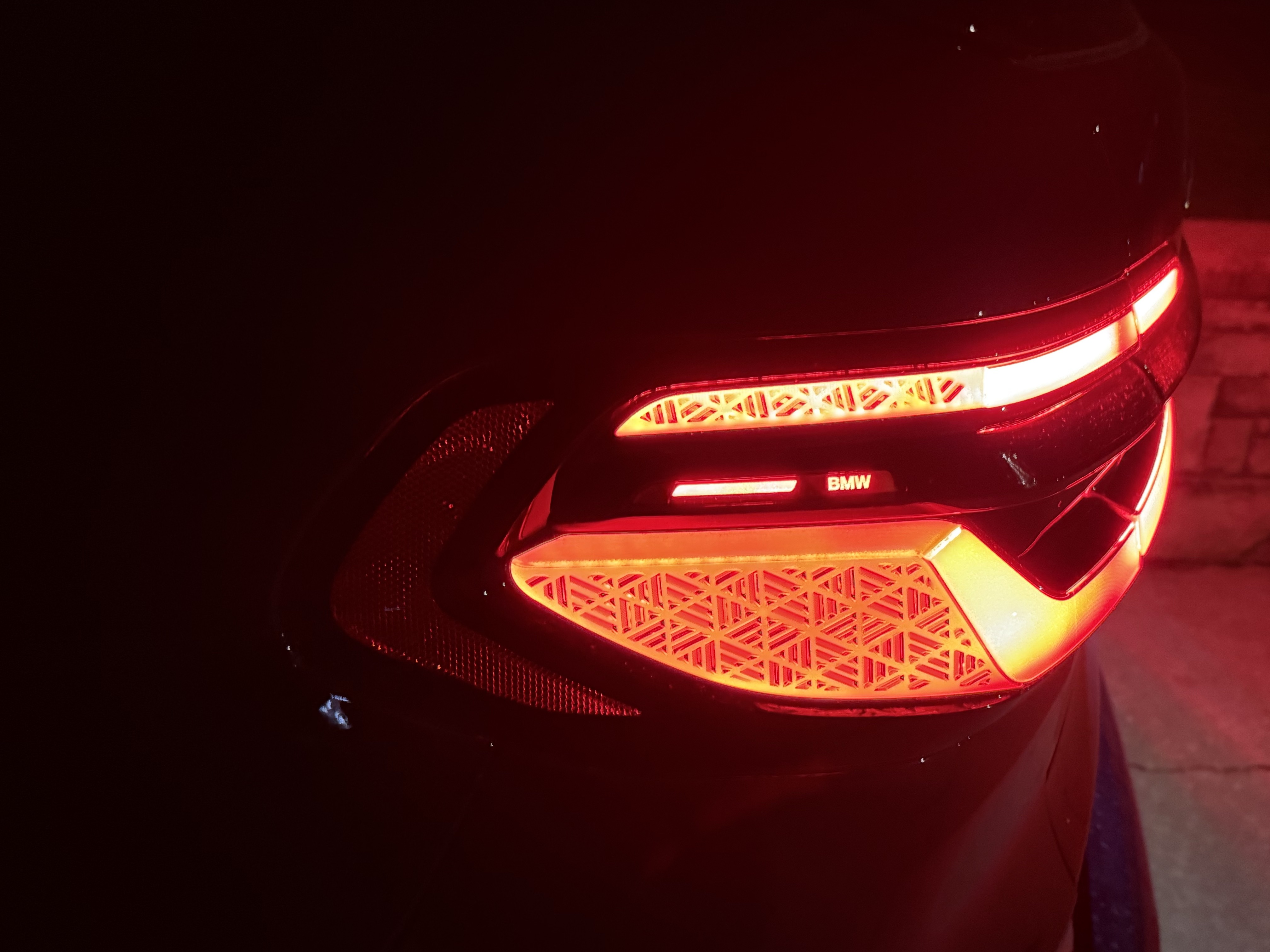 The Black BMW X7 taillight at night
